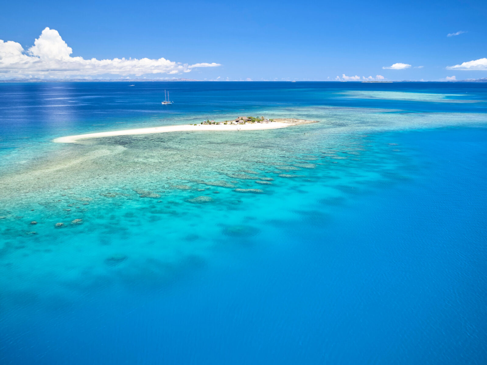 Remote,Island,In,Fiji,Overlooking,Blue,Coral,Reef