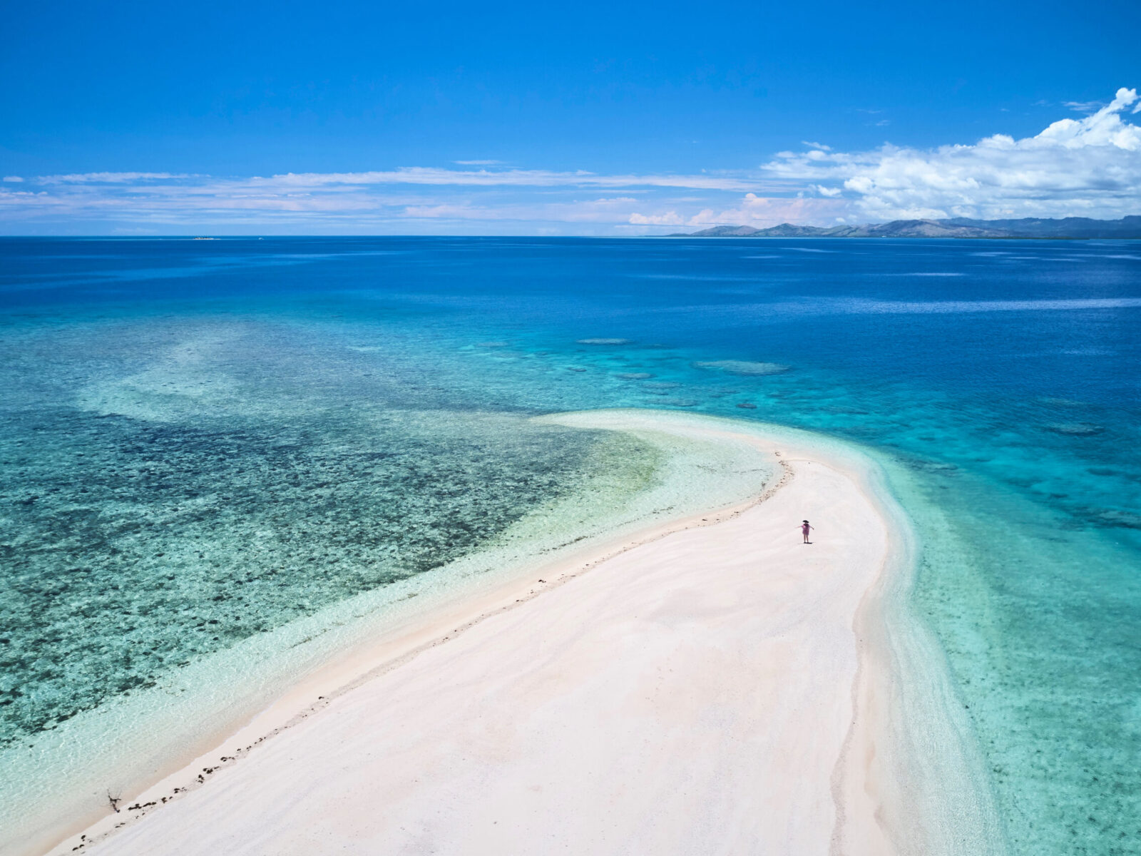 Woman,On,Remote,Island,In,Fiji,Overlooking,Blue,Coral,Reef
